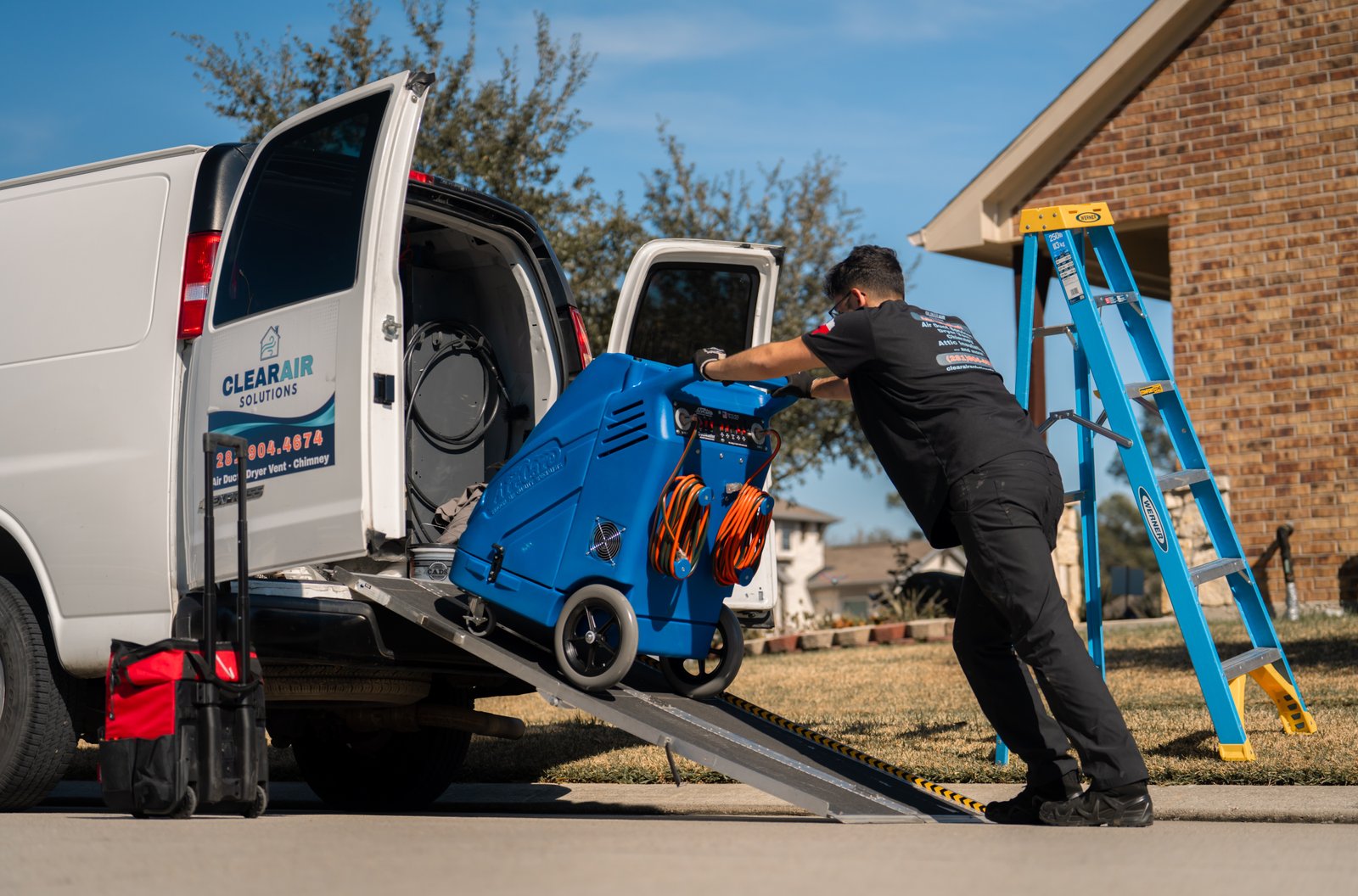 ClearAir Solutions technician performing duct cleaning service