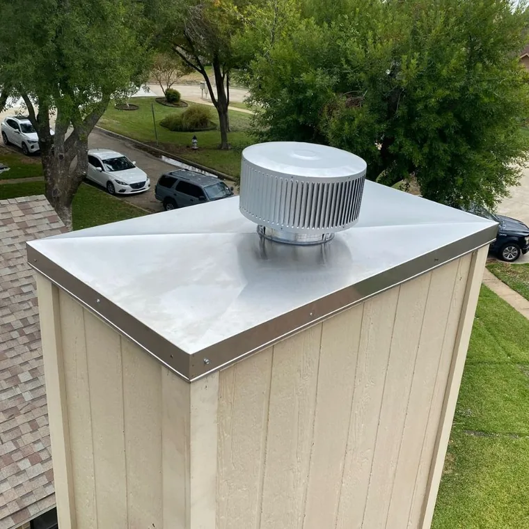 New stainless chimney cap installed on a chase cover in the Houston area