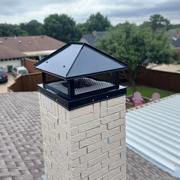 Black chimney cap installed on a brick chimney in Houston, TX