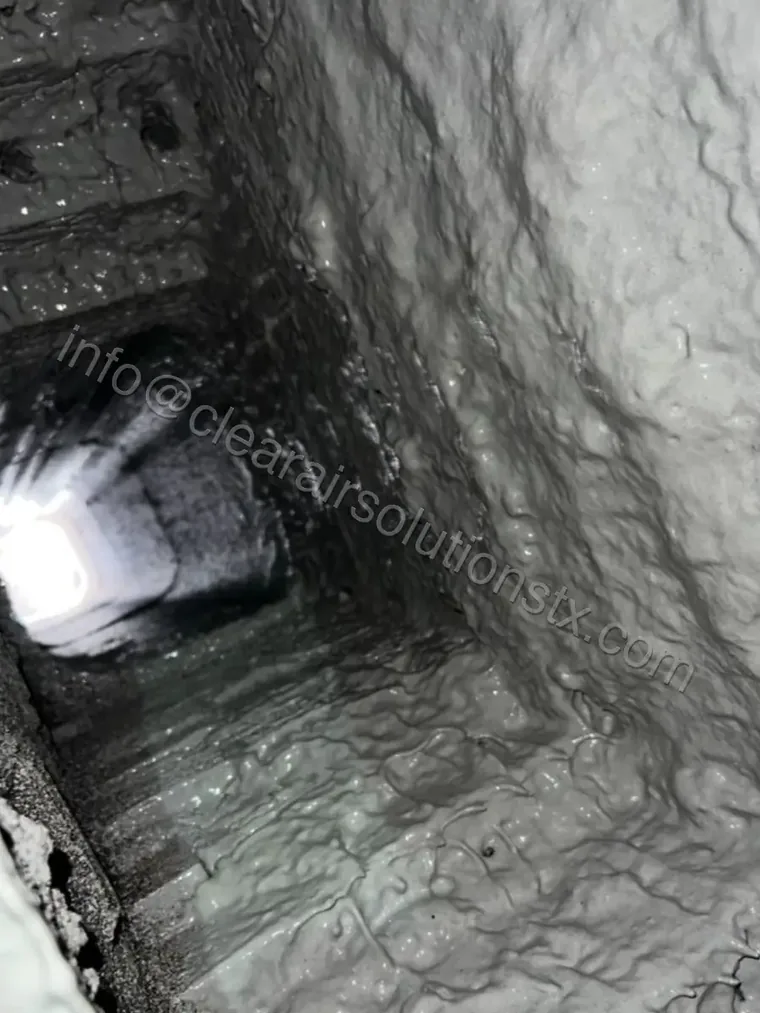 Chimney flue interior during a professional cleaning in the Houston area